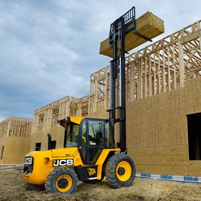 Forklift unloading machinery and industrial equipment in Wimbledon